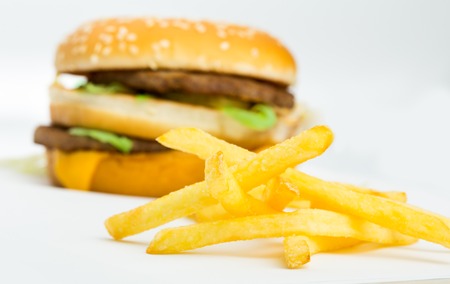 Burger and french fries isolated on white background