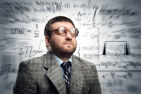 Professor in glasses thinking about math formulas