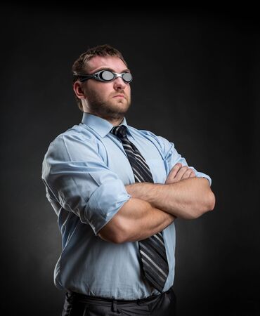 Businessman swimmer with crossed handsの写真素材