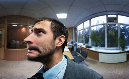 Frustrated and scared businessman in the office close upの写真素材