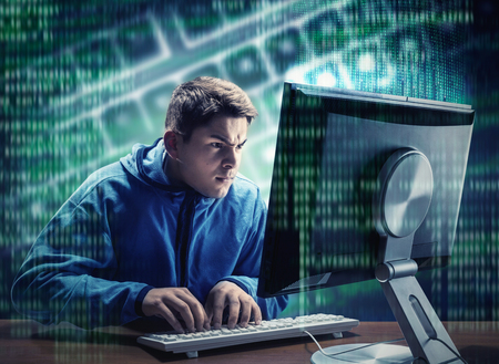 Hacker in is stealing information at homeの写真素材
