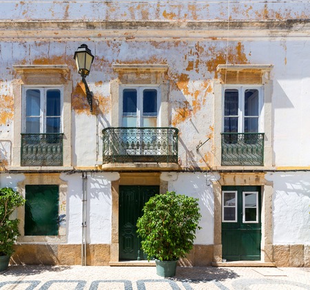Close up of old ragged building with faded paintの写真素材