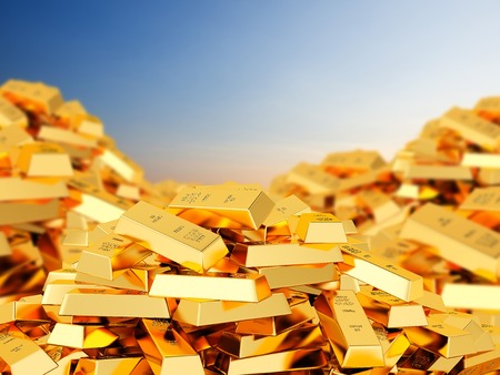 A big heap of bars of gold against the skyの写真素材