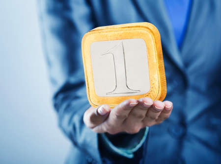 Businessman hand holding square coin on the palm