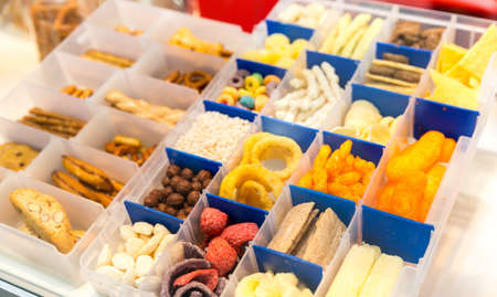 Different snacks in the boxesi n the shop close upの写真素材