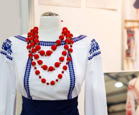 Urkainian dress on the mannequin with red beadsの写真素材