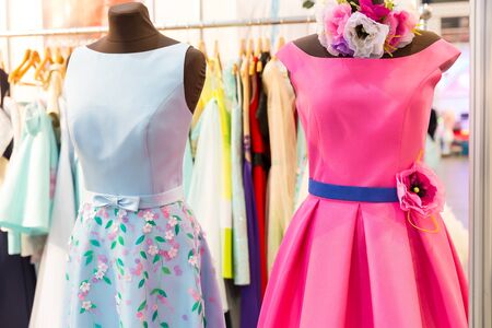 Beautiful modern dresses on the mannequins in the shopの写真素材