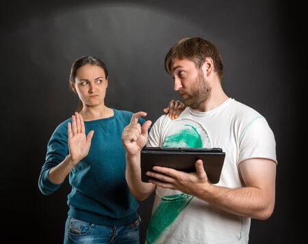 Couple is ordering something in the internetの写真素材