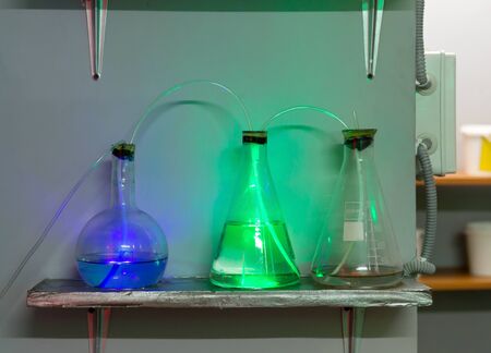 Three flasks with chemical reagentsの写真素材