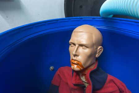 Plastic man in a plastic binの写真素材