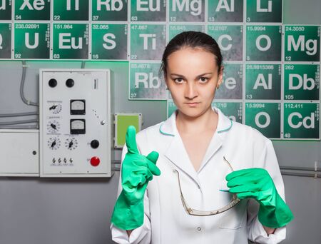 Serious woman with test tube in the labの写真素材