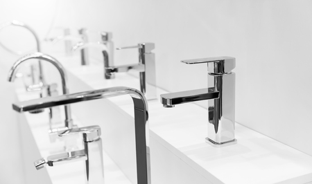 Show-bench with modern bath mixers and tapsの写真素材