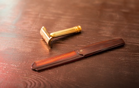 Machine for shaving and comb on the tableの写真素材