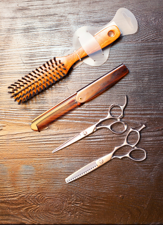 Close up of barber's tools on the table over brick wallの写真素材