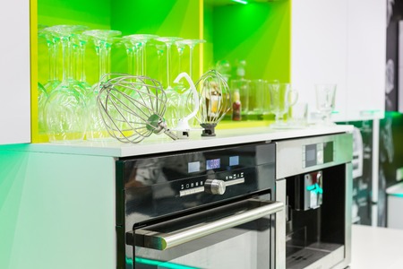 Professional kitchen interior with green furniture and modern equipmentの写真素材