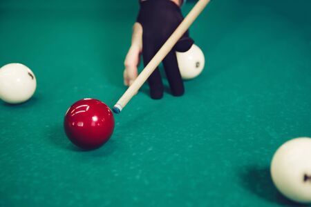 Close up of man preparing to shoot playing billiard