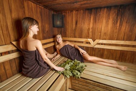 Beautiful laughing girls relax after spa therapy.の写真素材