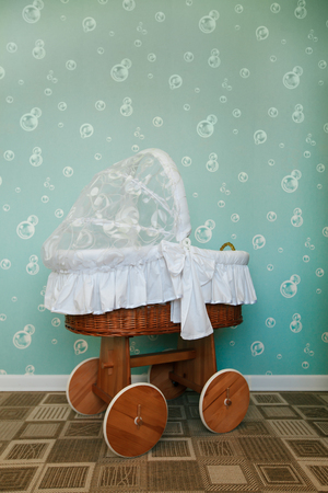 Preschool room decorated with baby carriage and carpet on the floor. Kindergarten concept.の写真素材