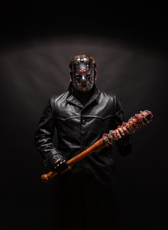 Bloody maniac in mask and black leather coatの写真素材