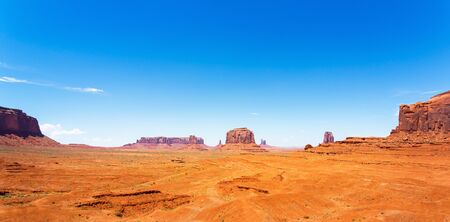 Sandstone mountains in desert of Monument Valleyの写真素材