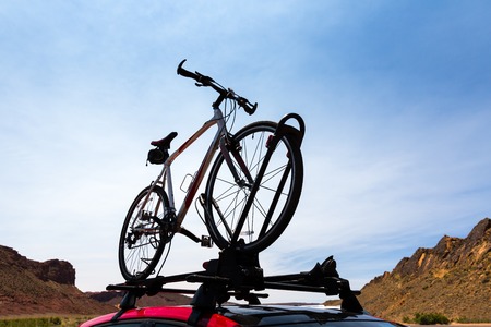 Bike transportation on the roof of a car.の写真素材