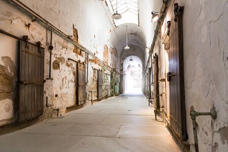 Jail hallway with locked doors.
