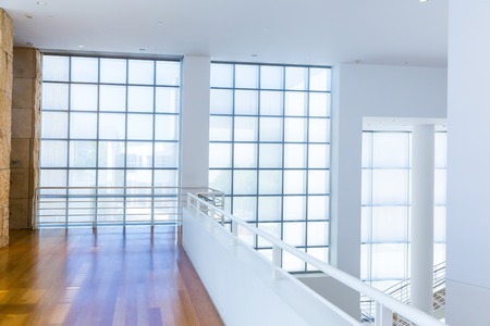 Balcony with wooden floor against glass block wallの写真素材