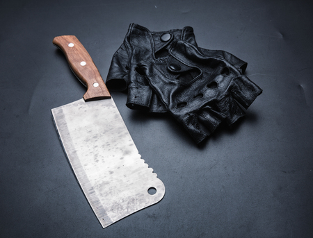 Meat cleaver and fingerless leather gloves