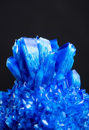 Blue salt crystal isolated on black backgroundの写真素材