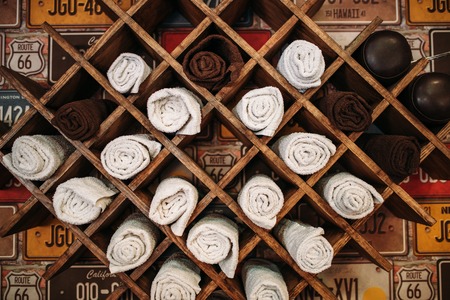 Wooden shelf with many compartments for towelsの写真素材