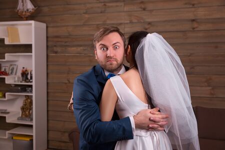 Newlyweds embracing on wedding photo shootの写真素材