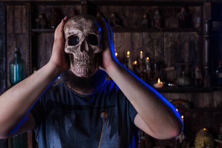 Male person with skull mask on faceの写真素材