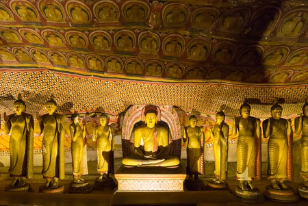 Ancient golden statues in buddha temple on Ceylonの写真素材