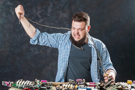 Engineer repairs components with soldering ironの写真素材