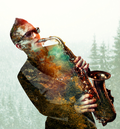 Saxophonist playing on saxophone, double exposureの写真素材