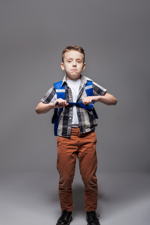 Schoolboy with schoolbag, studio photo shootの写真素材