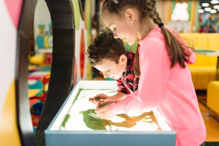Little kids having fun on attractionsの写真素材