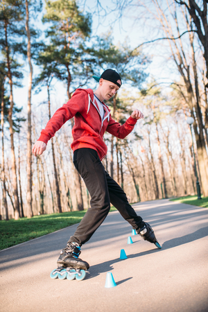 Roller skater, trick exercise in parkの写真素材