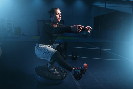 Athletic man on training, workout on pressの写真素材