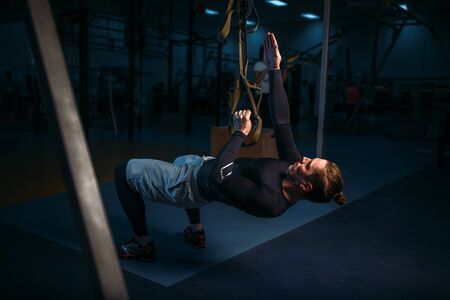 Sportsman on training,endurance workout with ropesの写真素材