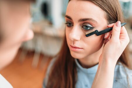 Makeup artist work with woman eyelashesの写真素材