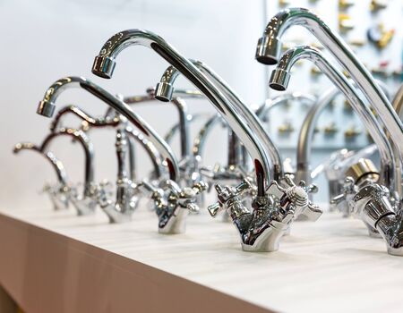 Kitchen faucets on shelf closeup, plumbing shopの写真素材