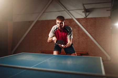 Table tennis, male player with racket and ballの写真素材