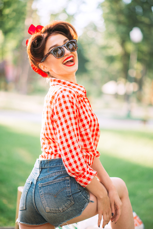 Sexy pinup girl outdoors, retro american fashionの写真素材