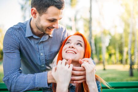 Romantic meeting of love couple in summer parkの写真素材