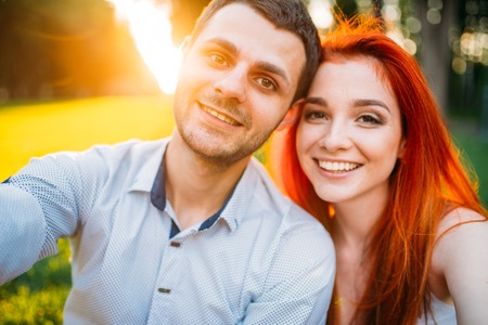 Selfie of love couple on sunset, romantic dateの写真素材