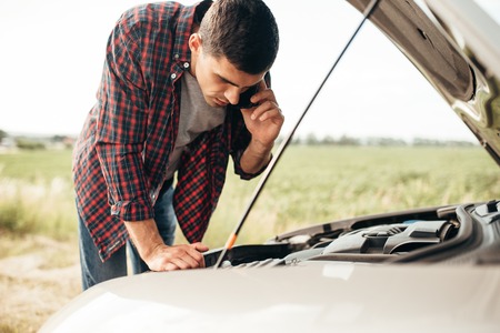 Man calls to service, trouble with vehicleの写真素材