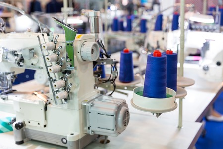 Sewing machine and cloth, nobody, clothing factoryの写真素材