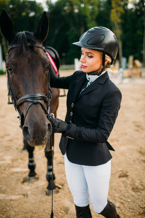 Equestrian sport, female jockey and horse faceの写真素材