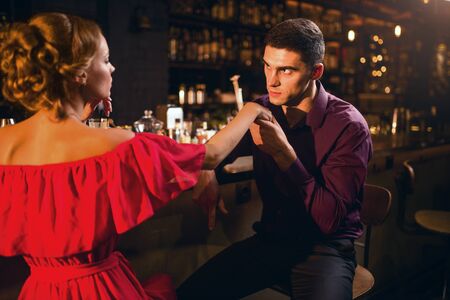 Romantic date in restaurant, woman flirts with manの写真素材